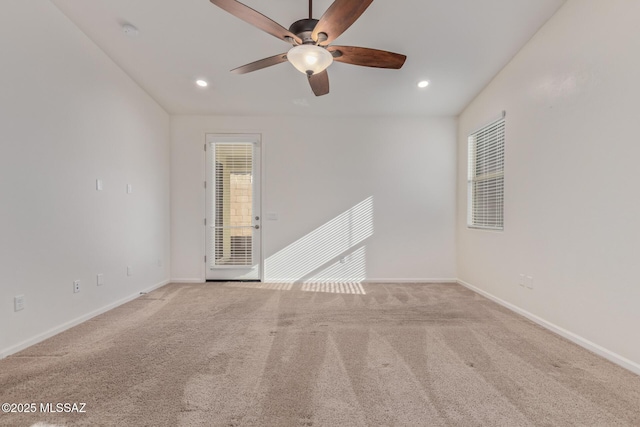 spare room featuring recessed lighting, baseboards, a ceiling fan, and carpet floors