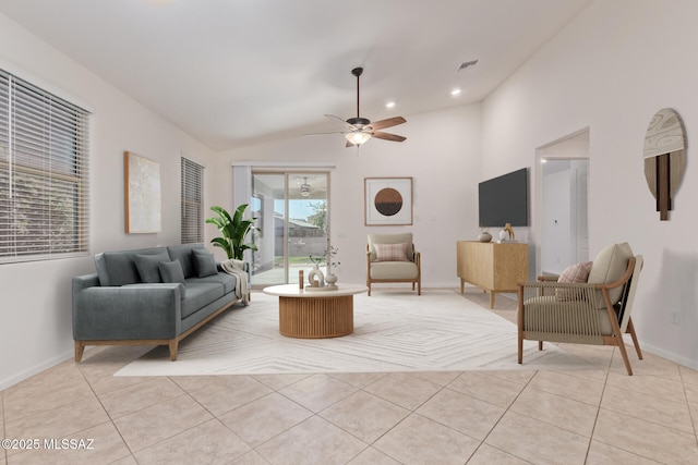 living room featuring light tile patterned floors, baseboards, visible vents, ceiling fan, and vaulted ceiling