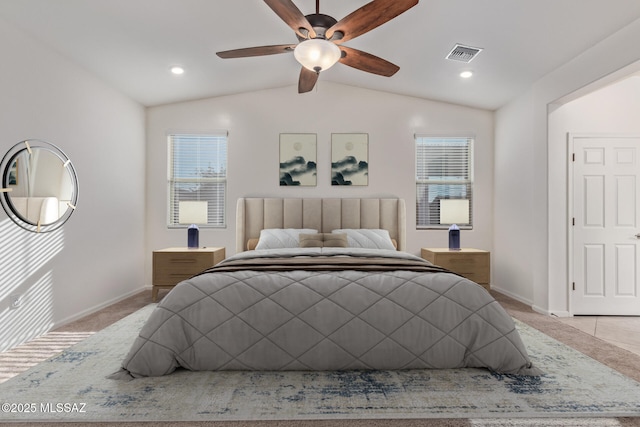 carpeted bedroom with a ceiling fan, lofted ceiling, baseboards, and visible vents