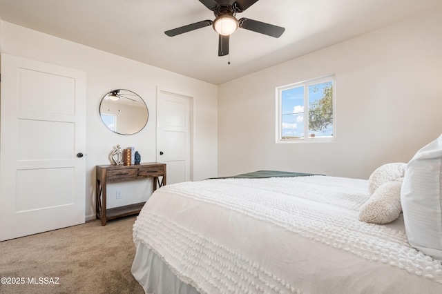 bedroom featuring light carpet and ceiling fan