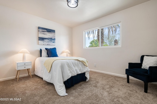 carpeted bedroom with baseboards