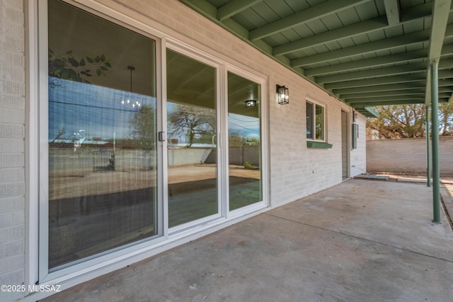 view of patio featuring fence