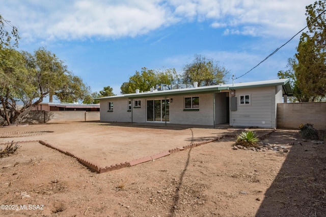 back of house with a patio area and fence