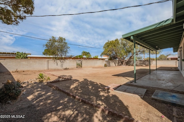 view of yard with a fenced backyard and a patio