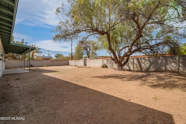 view of yard featuring a patio and a fenced backyard