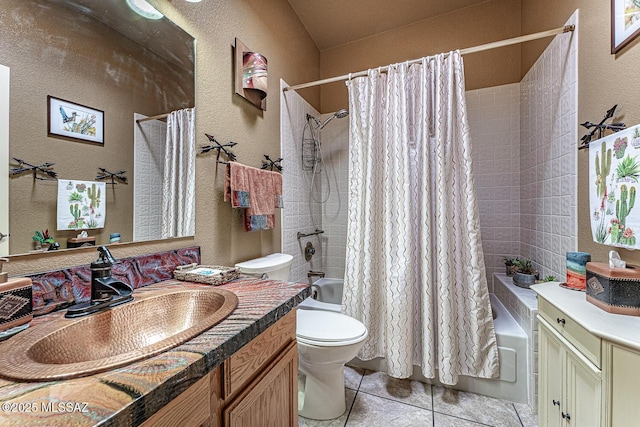 full bathroom with shower / bathtub combination with curtain, vanity, and a textured wall