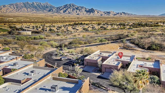 birds eye view of property featuring a mountain view