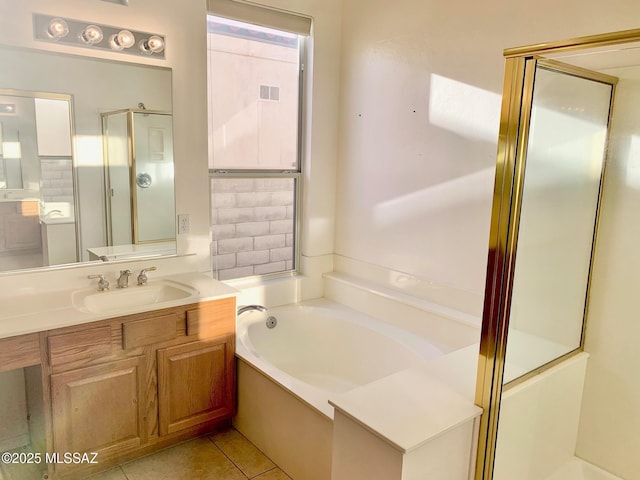 bathroom featuring visible vents, a shower stall, tile patterned flooring, a bath, and vanity