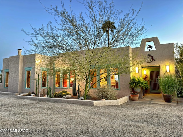 view of front of house featuring stucco siding