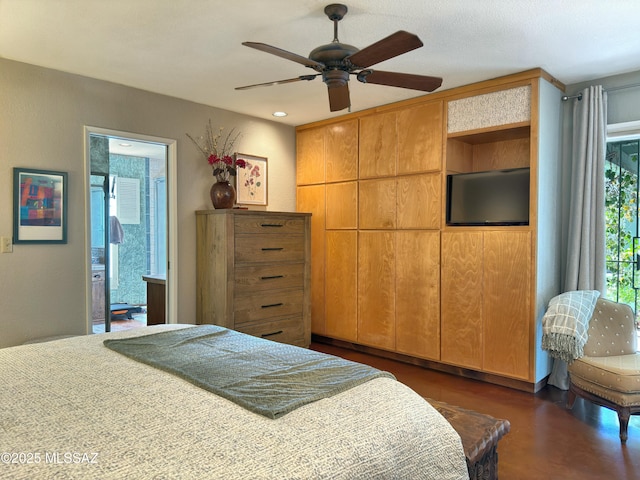 bedroom with ensuite bath and a ceiling fan