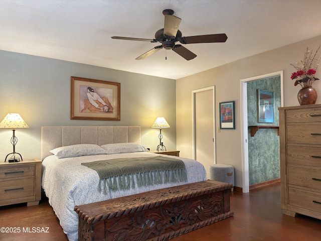 bedroom featuring ceiling fan and baseboards