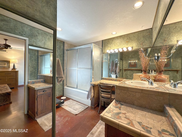 full bath with shower / bath combination with glass door, recessed lighting, ceiling fan, concrete flooring, and a textured ceiling