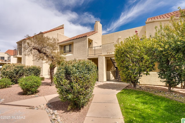 1200 E River Rd Unit J127, Tucson, AZ 85718 - view of property with stairway