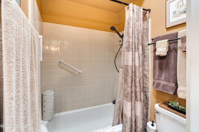 full bathroom featuring toilet and shower / bathtub combination with curtain