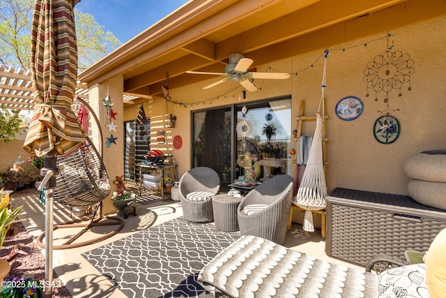 view of patio featuring a ceiling fan