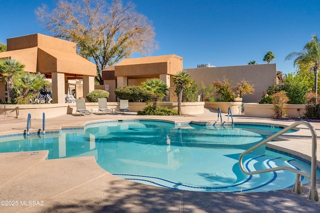 community pool featuring a patio area