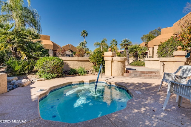 view of pool featuring a patio and fence