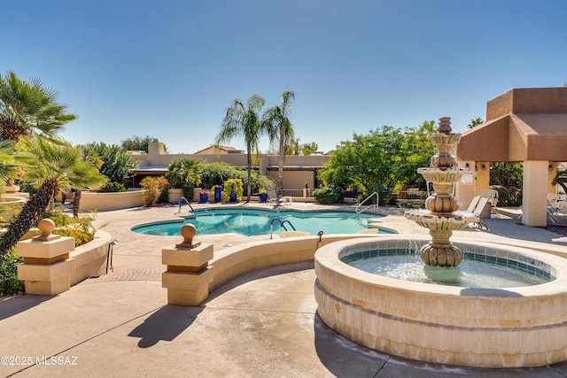 community pool featuring a patio area