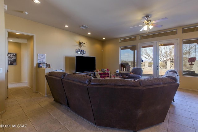 living room featuring visible vents, baseboards, recessed lighting, light tile patterned flooring, and a ceiling fan