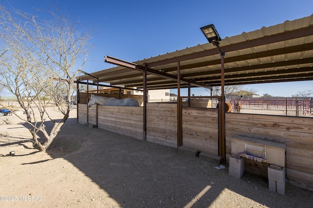 view of patio / terrace featuring an outbuilding and an exterior structure