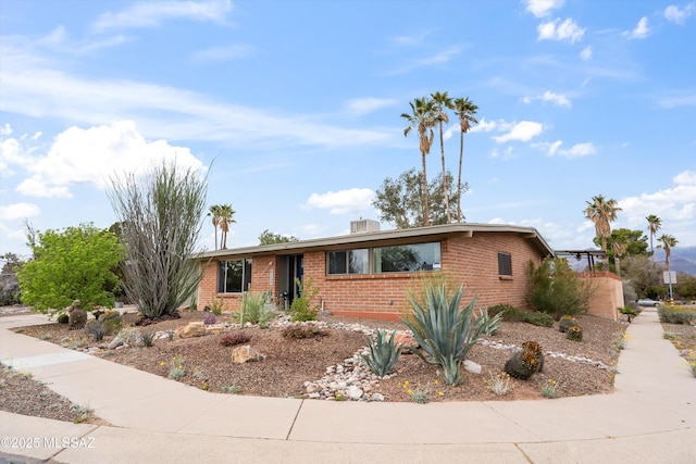 ranch-style house with brick siding