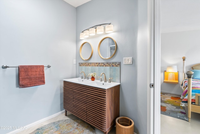 full bath with double vanity, decorative backsplash, baseboards, and a sink