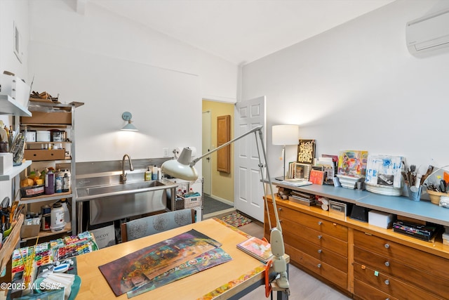 interior space with an AC wall unit and a sink