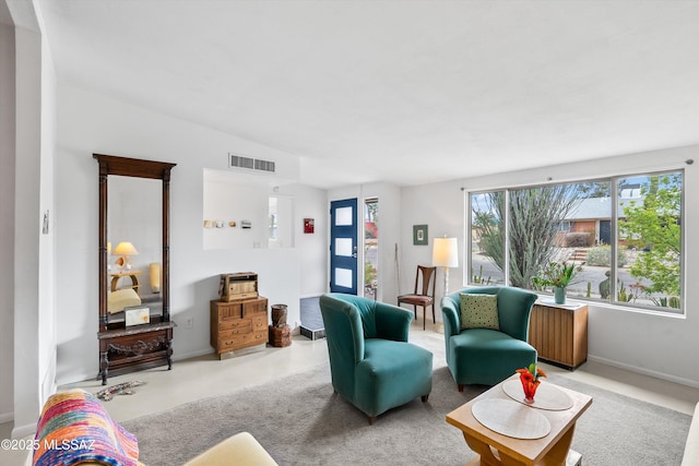 living room featuring visible vents