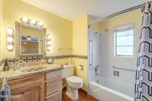 bathroom featuring tile patterned flooring, toilet, vanity, and shower / bath combo with shower curtain