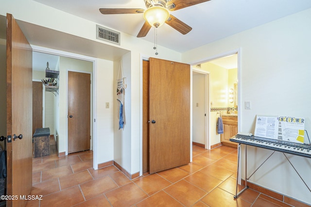 interior space with visible vents, baseboards, and light tile patterned flooring