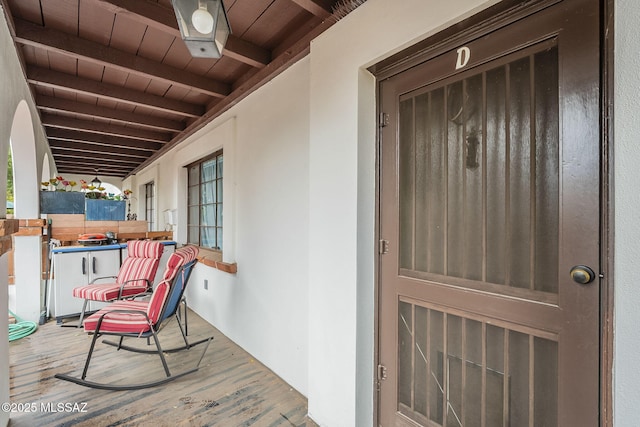 doorway to property featuring stucco siding