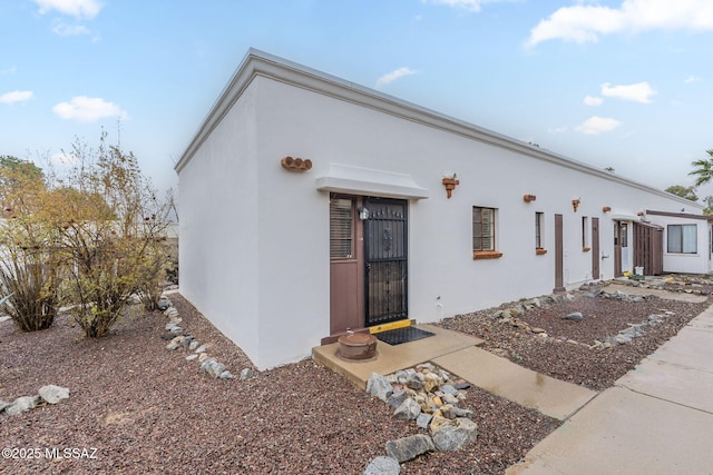 view of front of property featuring stucco siding