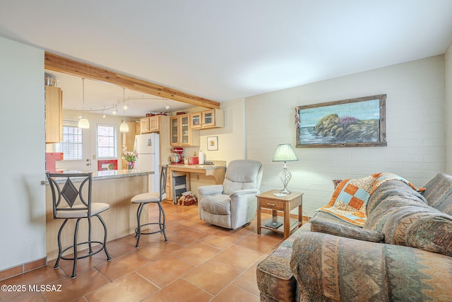 living room featuring beverage cooler and light tile patterned flooring