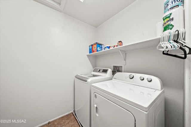 laundry room with washing machine and clothes dryer, laundry area, and baseboards