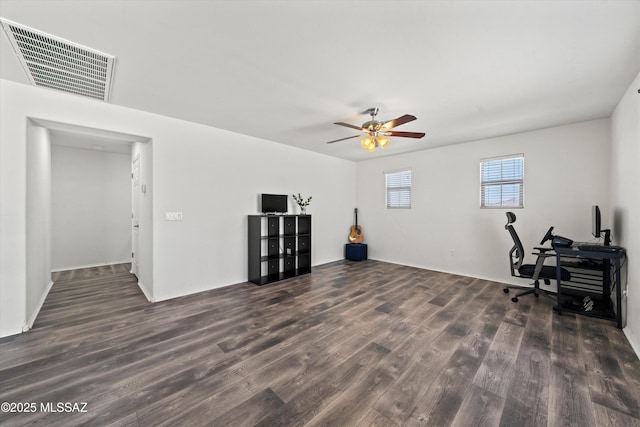 home office featuring ceiling fan, visible vents, and wood finished floors