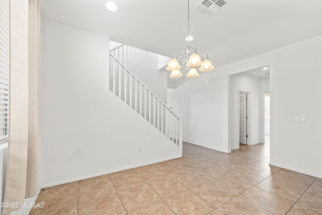 interior space featuring tile patterned flooring, visible vents, baseboards, stairs, and an inviting chandelier