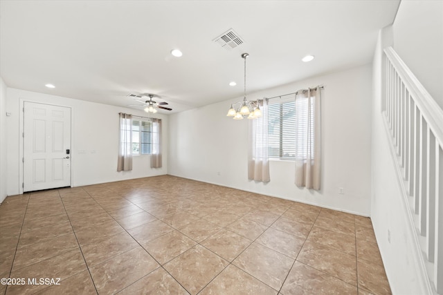 empty room with recessed lighting, ceiling fan with notable chandelier, visible vents, and light tile patterned floors
