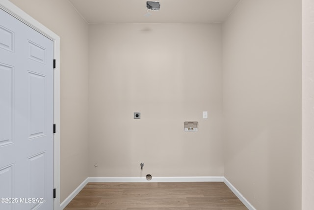 laundry area featuring laundry area, electric dryer hookup, light wood-style floors, and washer hookup