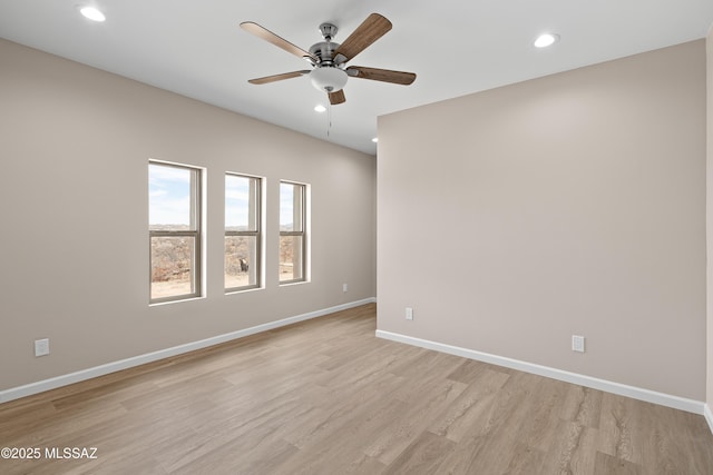 empty room featuring recessed lighting, baseboards, light wood-style flooring, and a ceiling fan