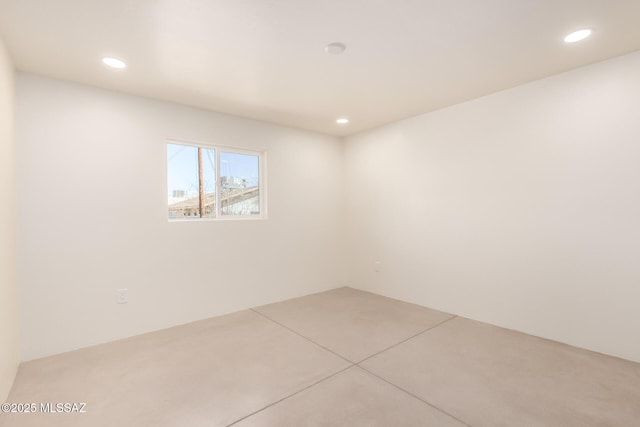 empty room featuring recessed lighting and concrete flooring