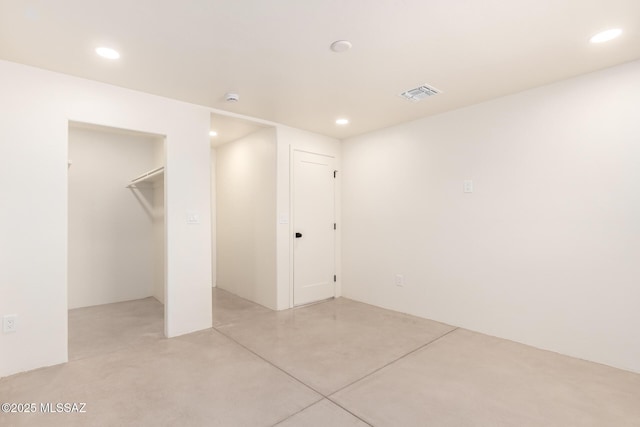 basement featuring recessed lighting and visible vents