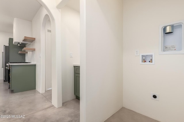 laundry room with hookup for a washing machine, arched walkways, hookup for an electric dryer, and laundry area