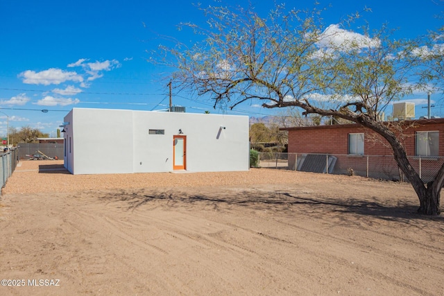 view of outdoor structure featuring fence