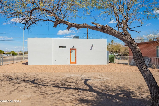 view of outdoor structure featuring fence