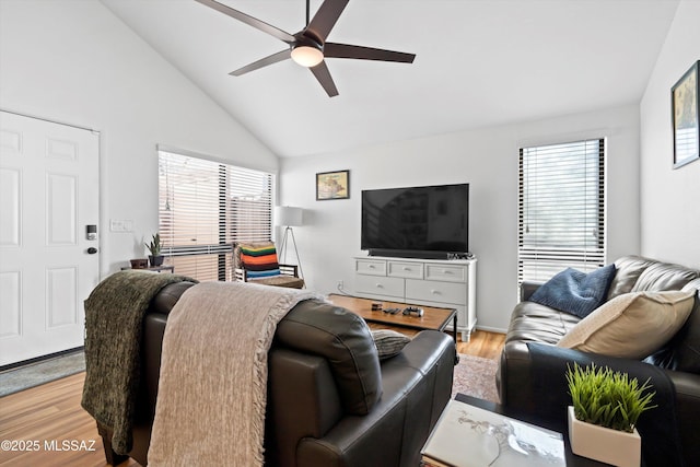 living room with light wood-type flooring, lofted ceiling, and ceiling fan