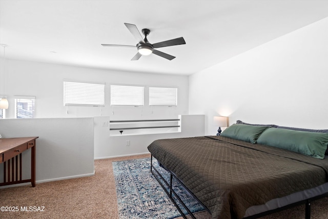 bedroom featuring baseboards, ceiling fan, and carpet flooring