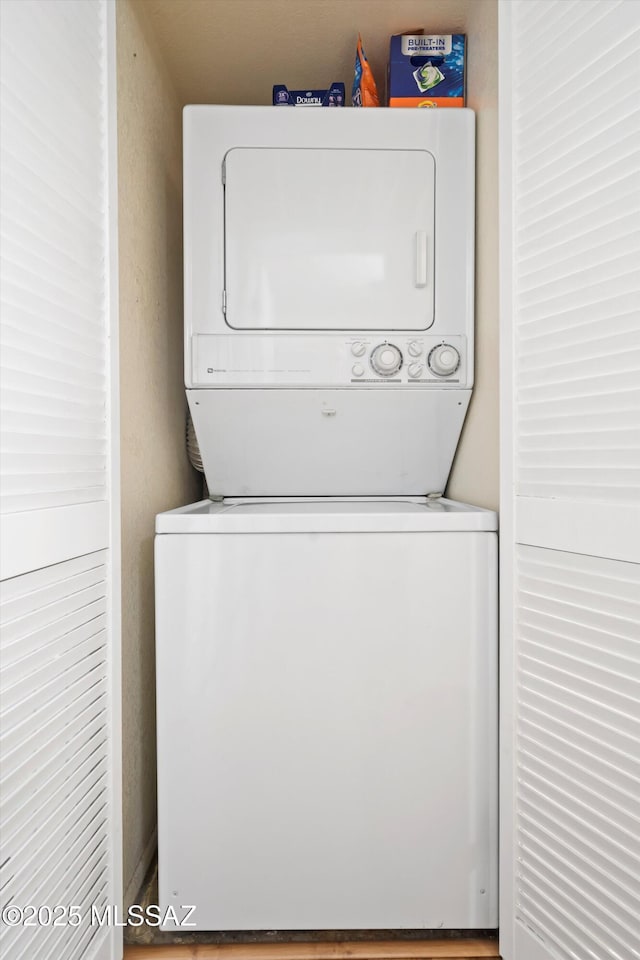 laundry area featuring laundry area and stacked washing maching and dryer