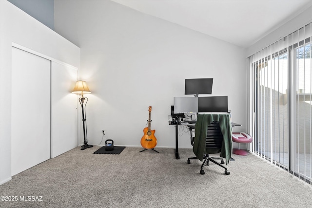 office space featuring vaulted ceiling and carpet floors