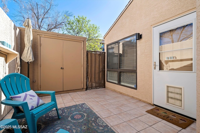 view of patio / terrace with a gate