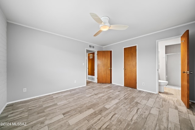 unfurnished bedroom featuring visible vents, crown molding, and wood finished floors